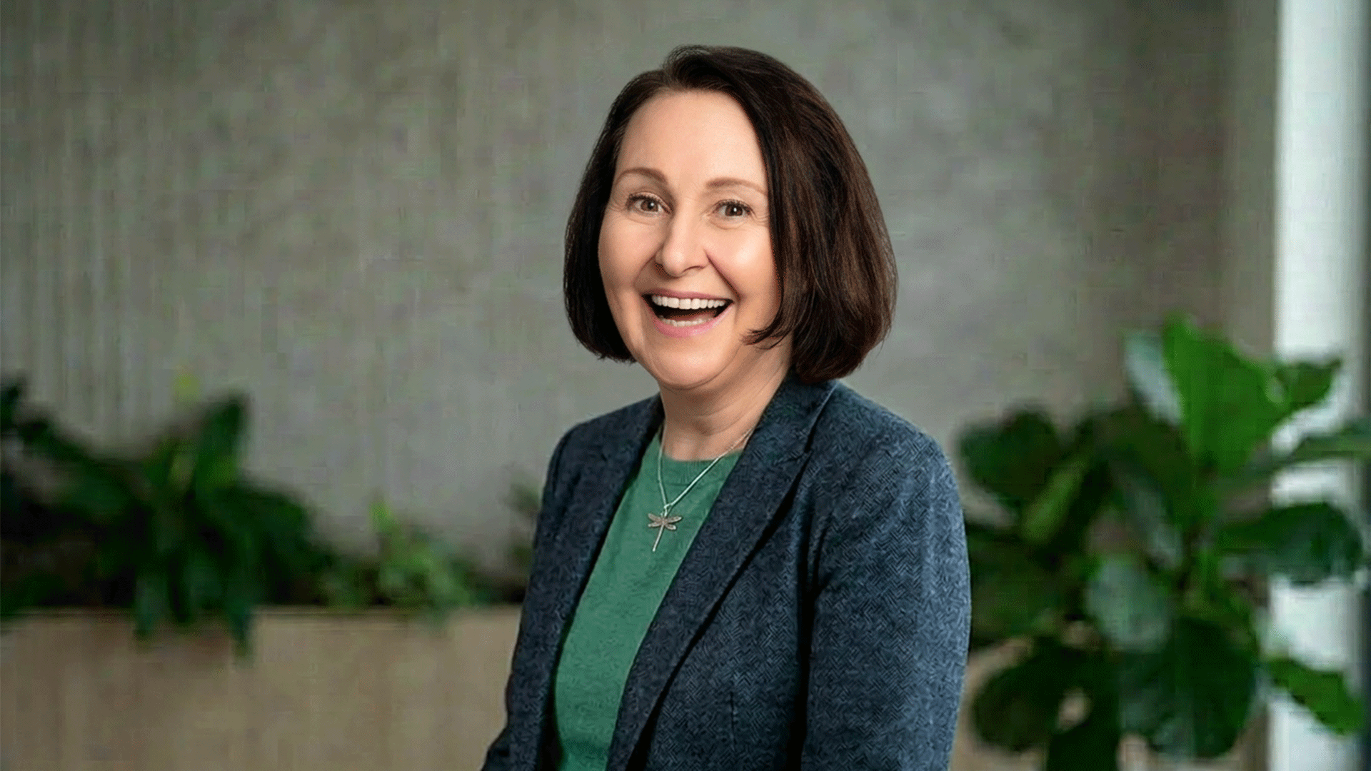smiling in a professional headshot